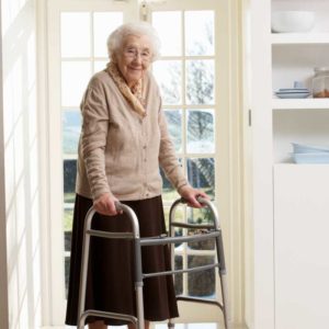 an elderly woman with a walker