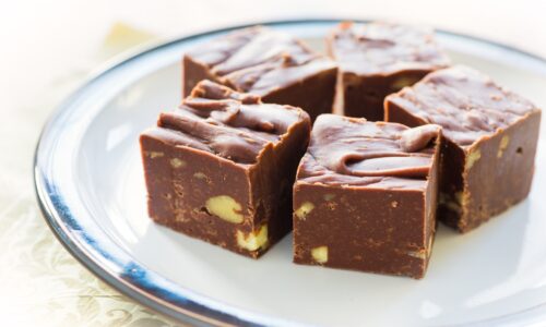 a plate of fudge with nuts in it